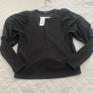 Long sleeved top size medium. Sleeves have bouffant flair.
